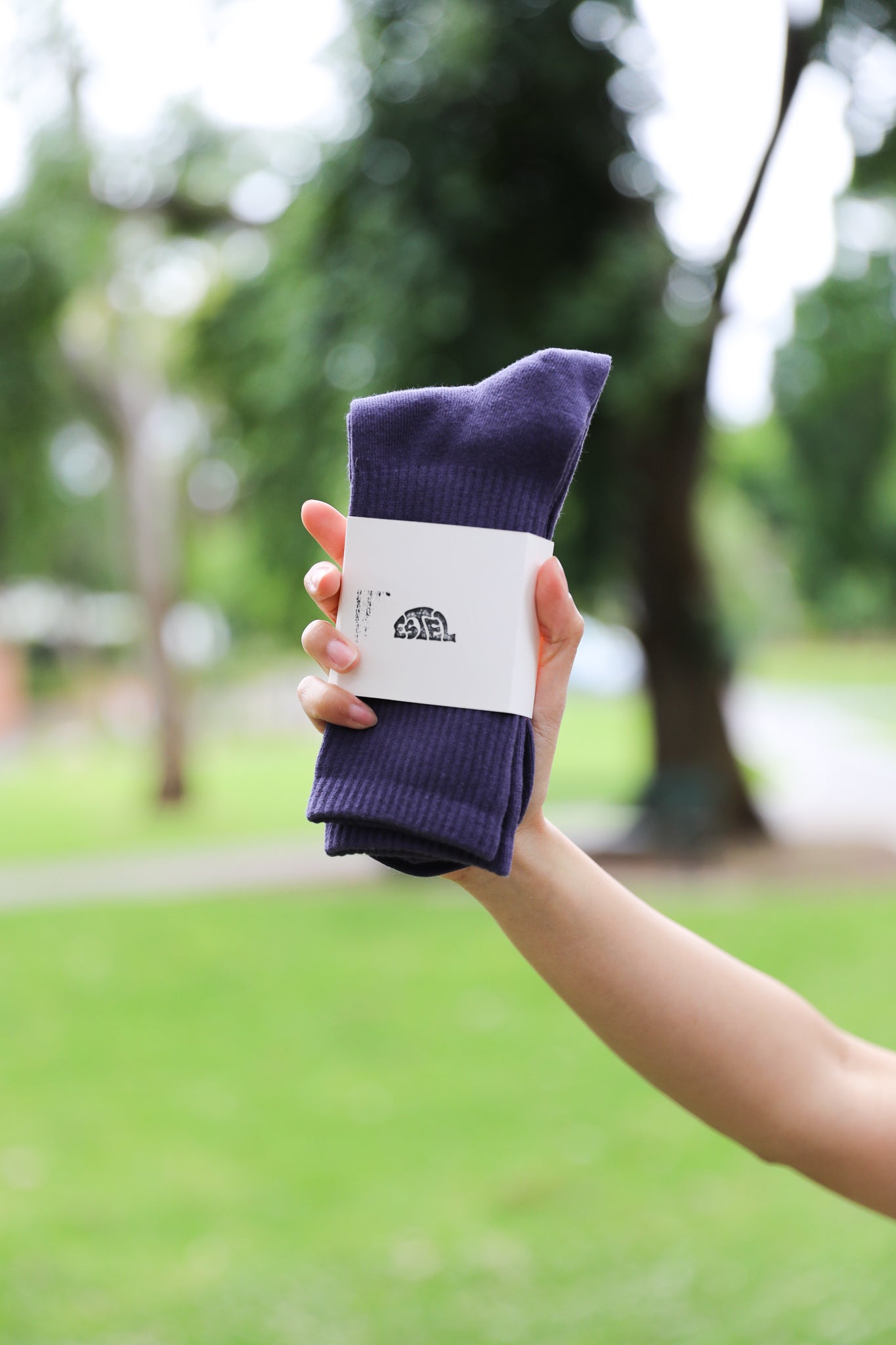 Model holding navy Estel socks