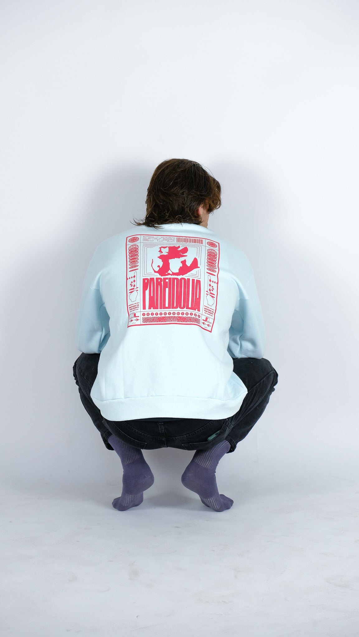 back of model 1 wearing ice blue sweat